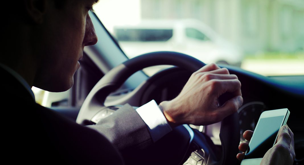 How can fleet managers prevent distracted driving among employees?