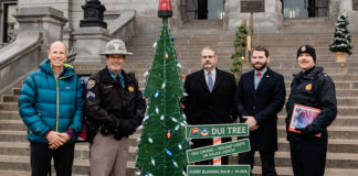 The 3D “DUI Tree” is decorated with 100 large white holiday lights. For every 10 DUIs reported during the enforcement period, a white bulb will be replaced on the tree with a red or blue bulb to represent police lights. Signs accompany the tree with the message, “You Choose — Holiday Lights or Police Lights.”