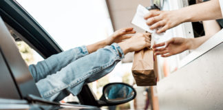 In an Australian first NSW drivers are permitted to use their phone as a digital wallet, provided their vehicle is stationary and off road, in a car park, drive-through or driveway.