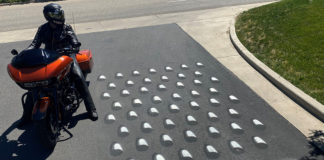 A human cheese grater has been painted on the road at Performance Cycle, as well as other locations throughout the state, and aims to remind bikers that falling on asphalt at any speed can result in serious bodily injury or death.