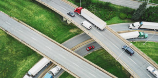 The rule requires rear impact guards on trailers and semi-trailers with sufficient strength and energy absorption to protect occupants of passenger vehicles in multiple crash scenarios.
